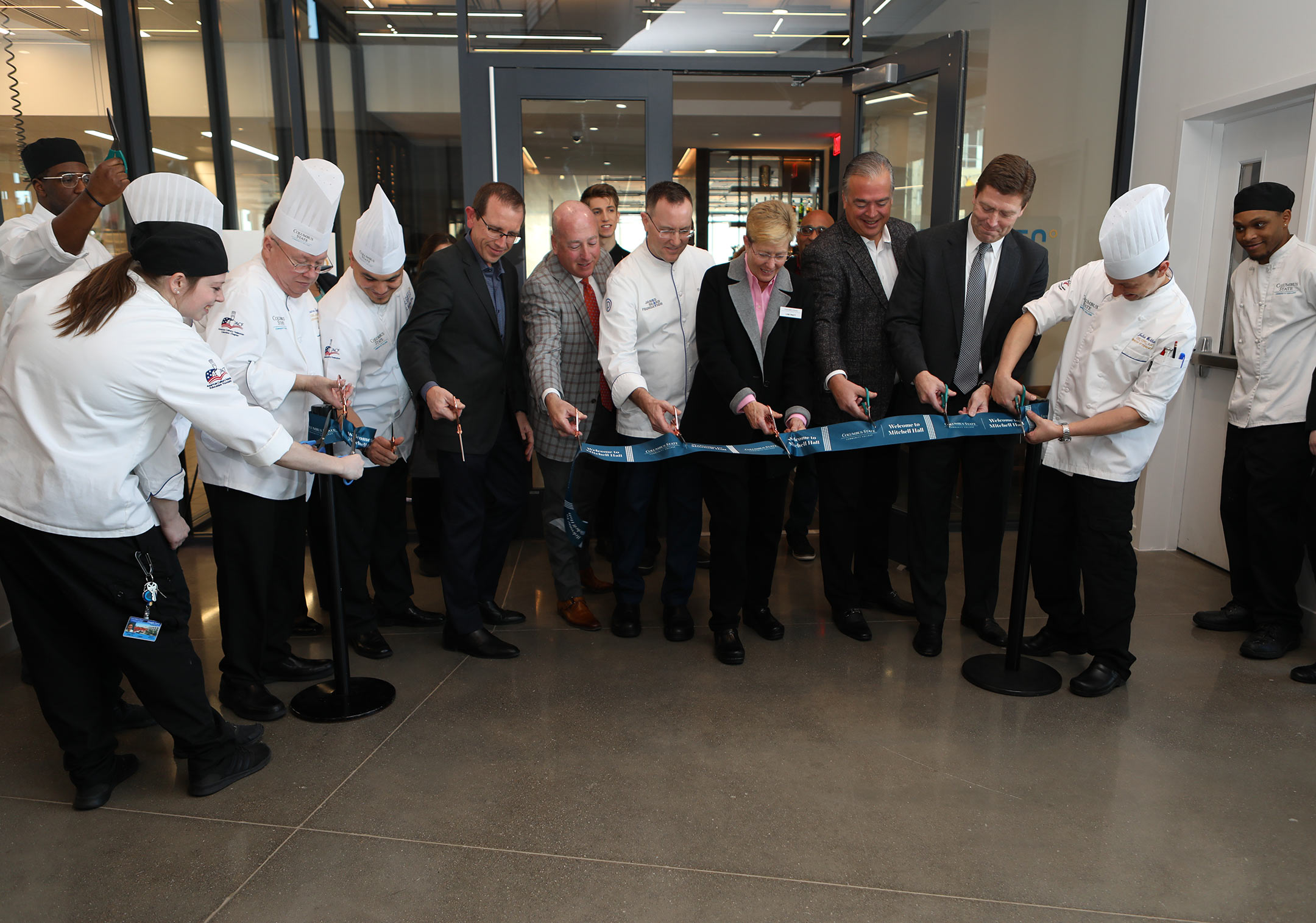 The ribbon cutting ceremony outside the restaurant.