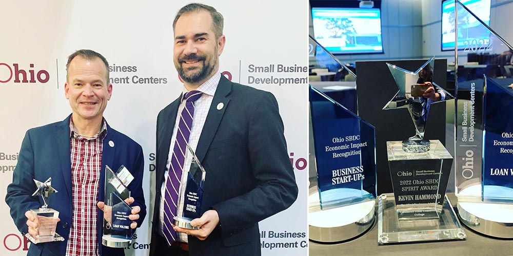 Kevin Hammond, left, with Jim Laipply, deputy chief and SBDC state director, Office of Small Business Development. On the right are the awards for Loan Volume, Business Start-Ups, and Spirit. 