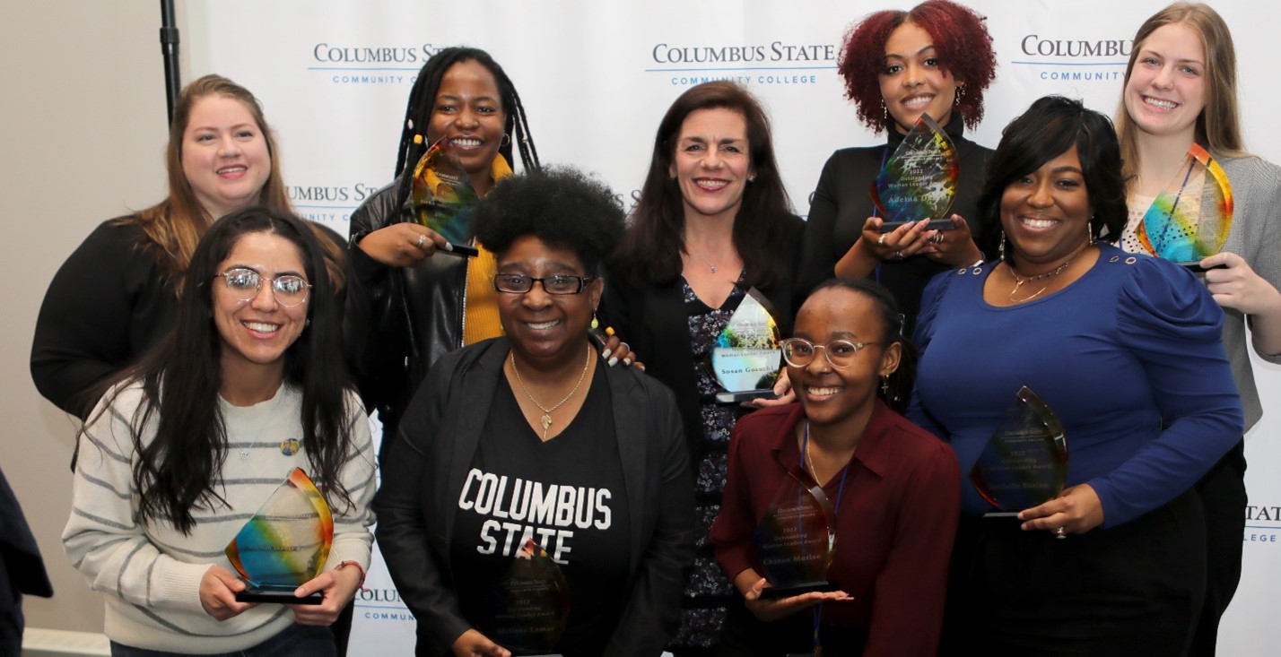 Winners from 2022, back row left to right, Amanda Perk, Susana Vega , Mariama Sumaila Basintale, Melissa Lamar,  Susan Goeschl. Front row: Chinue Mutiso, Adeina Davis, Rochelle Burton, Emma Nicola (accepted award on behalf of Shelley Casbarro). 
