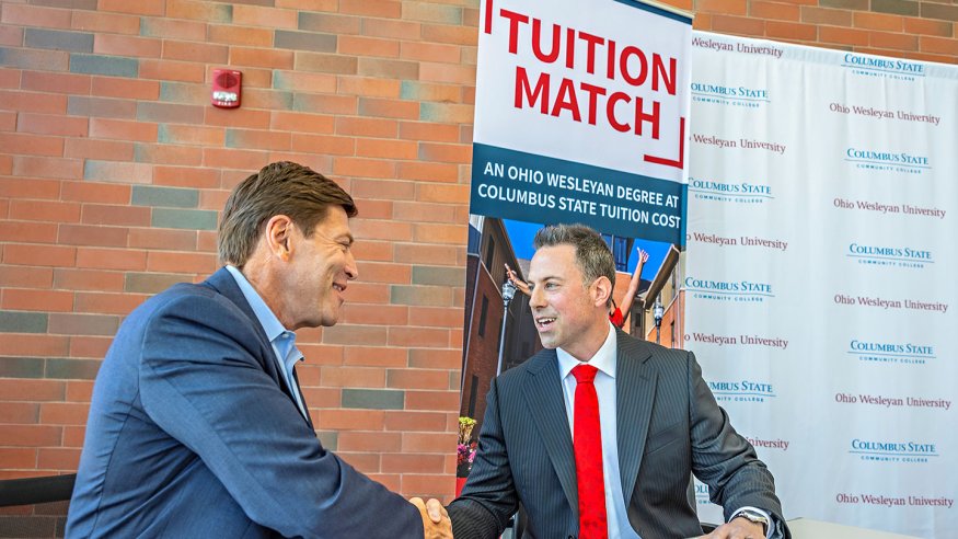 President David Harrison of Columbus State Community College and President Matt vandenBerg of Ohio Wesleyan University shake hands after signing a landmark agreement April 18 at Columbus State's Delaware Campus.