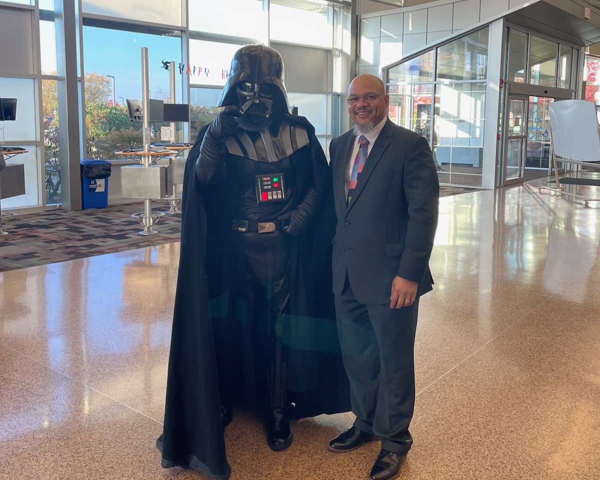 Executive Administrator Dale Gresson with student Adam Meeks. 