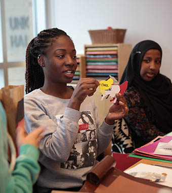 Students explaining farm animal shapes in Early childhood education classroom.