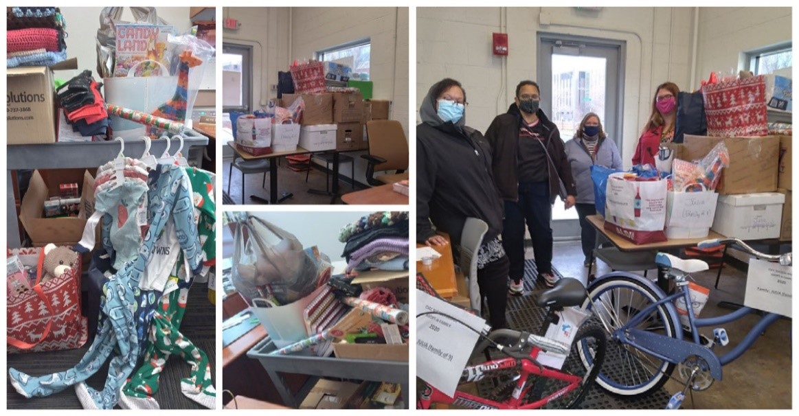 Members of Business Services prepare their gift package for a family.