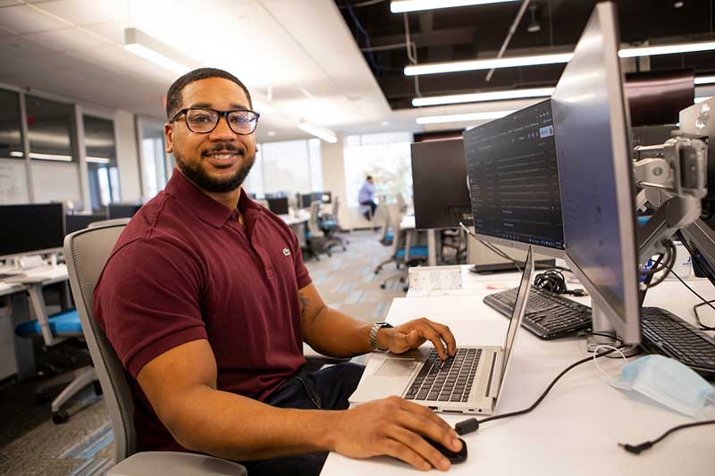 
National Science Foundation funding has been an integral part of building Columbus State’s IT Flexible Apprenticeship program, which embeds learn-and-earn workforce experience into degree attainment, and typically results in full-time employment upon graduation. Former student Garret Braxton, pictured, leveraged his experience within ITFA to become a software engineer after completing his associate degree.

