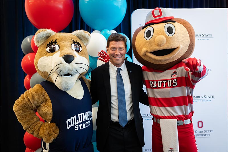 President David Harrison shown with Claudette and Brutus Buckeye mascots.