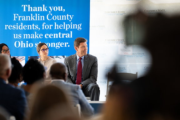Columbus State President David T. Harrison listens to a speaker during the groundbreaking ceremony.