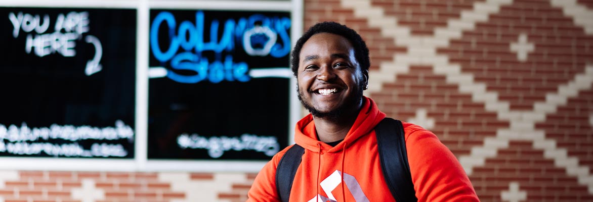 Smiling male student at event