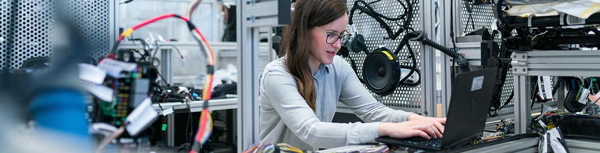 Scholarship header image of woman and computer