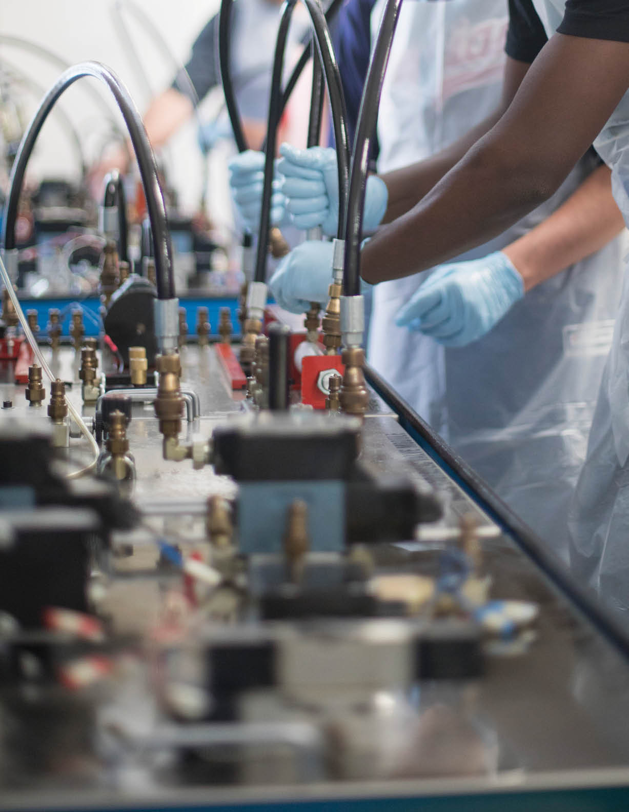 Photos from the Advanced Automation Summer Camp, Summer 2017  High school students are doing various activities in the Integrated Systems Technology (IST) Lab on campus  Related to the Modern Manufacturing Work Study (MMWS) program  NOTE: Students should be wearing safety goggles, some are not so use photos with caution  NOTE: Students should be wearing safety goggles, some are not so be cautious when using the photo depending on visibility level 