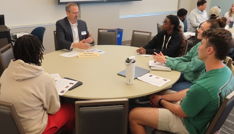 Students meet with professionals at the speed networking event in WD. 