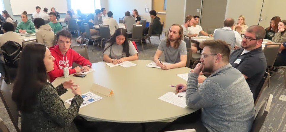 Students meet with professionals at the speed networking event in WD. 