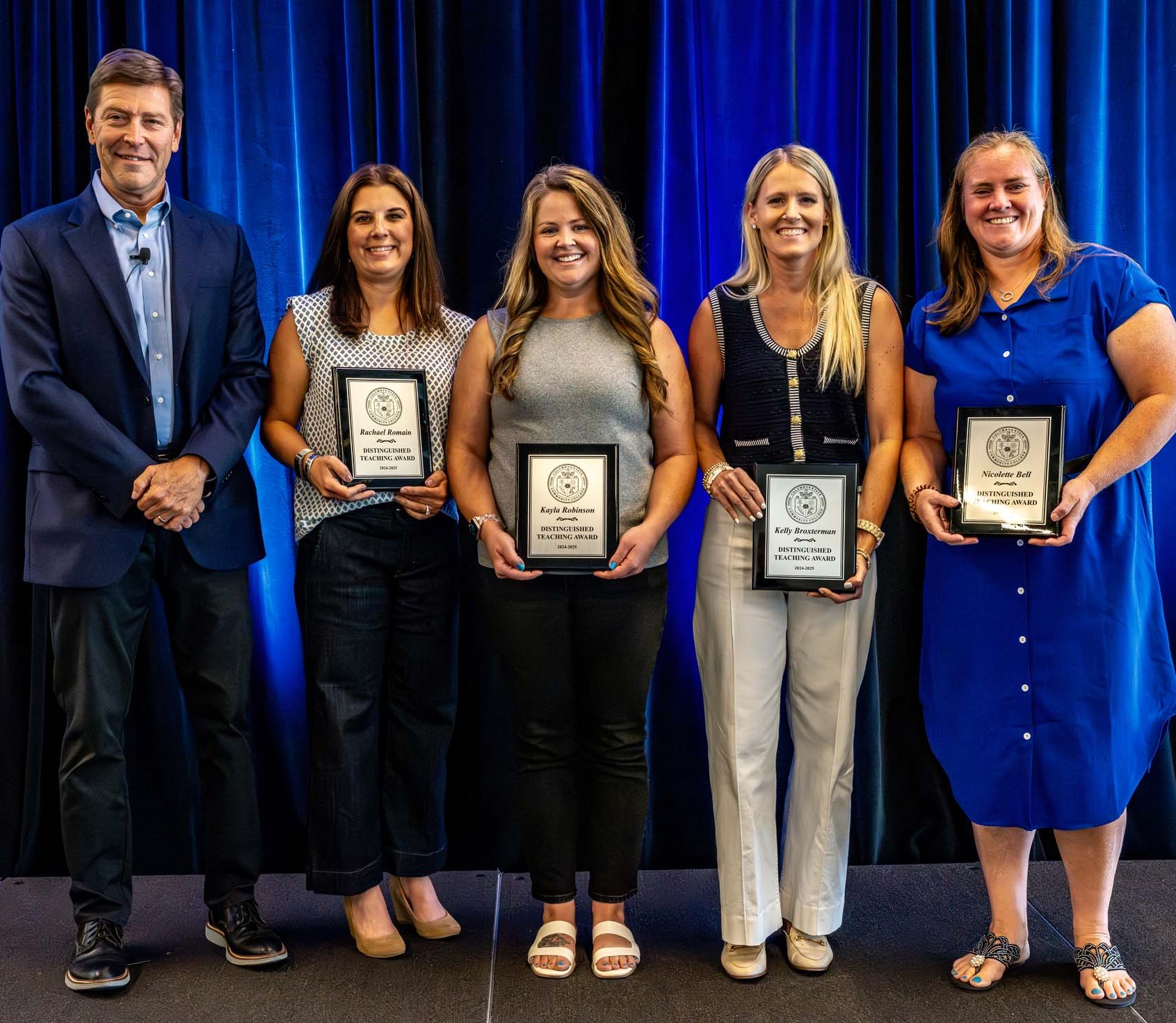 left to right: President Harrison, Rachael Romain, Kayla Robinson, Kelly Broxterman, and Nicolette Bell.