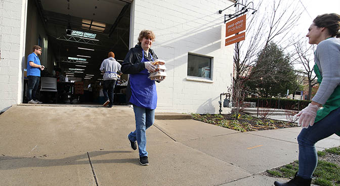 
Mary Beth Arensberg, community volunteer distributing food.
