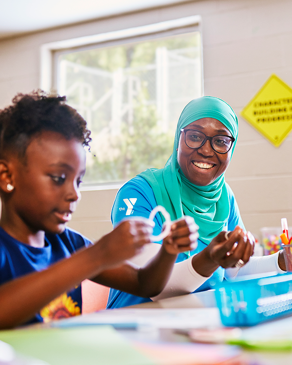 Childcare worker with child