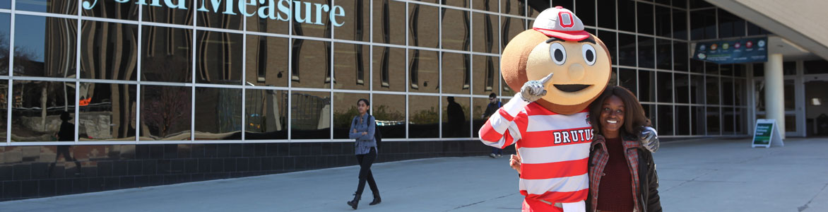 Student with Brutus, the Ohio State mascot